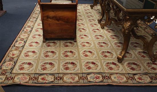 An Aubusson beige ground carpet, 14ft 1in. by 10ft 8in.